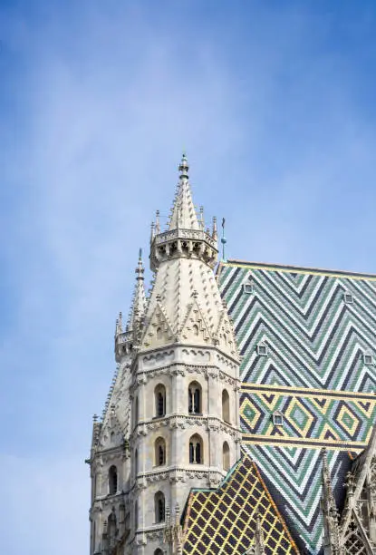 Top view of the towers of St. Stephen's Cathedral Stephansdom in Vienna against the blue sky in a vertical format