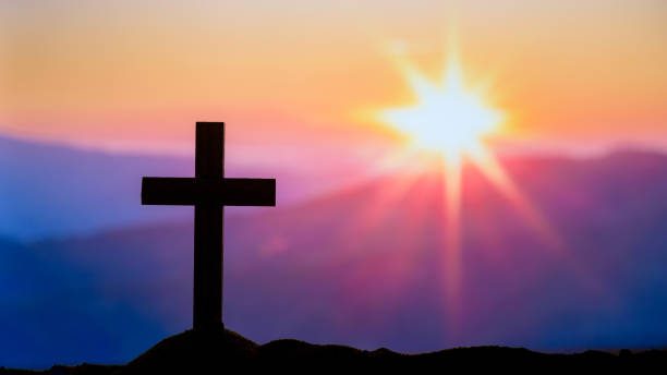 Silhouette Cross on the mountains