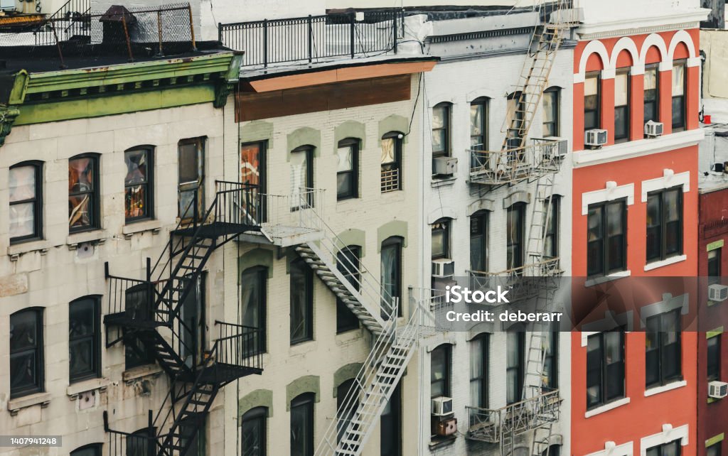 Old apartment buildings along Bowery street in Manhattan, New York City Old apartment buildings along Bowery street in Manhattan, New York City NYC Apartment Stock Photo