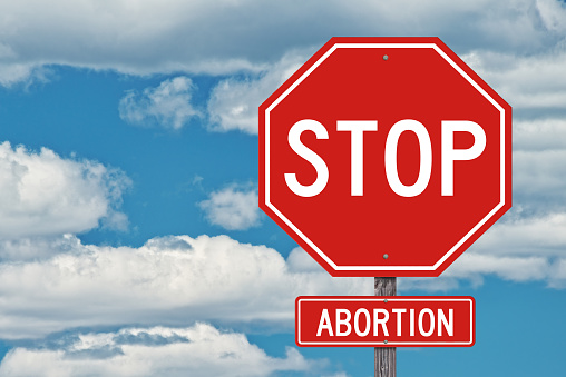 Stop Abortion Sign - Blue Sky Background