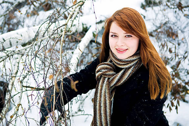 Girl in winter park stock photo