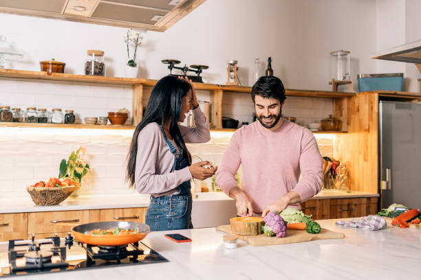 istock Handsome Man Cooking at Home 1407957333