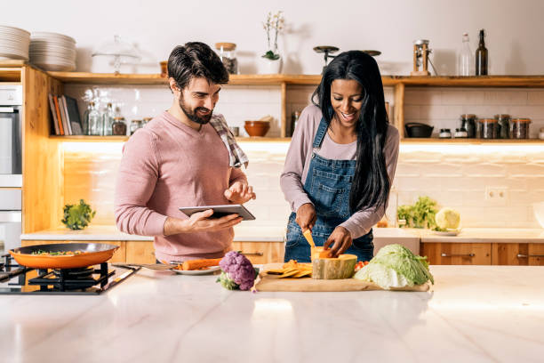 istock Happy Couple Cooking at Home 1407957344