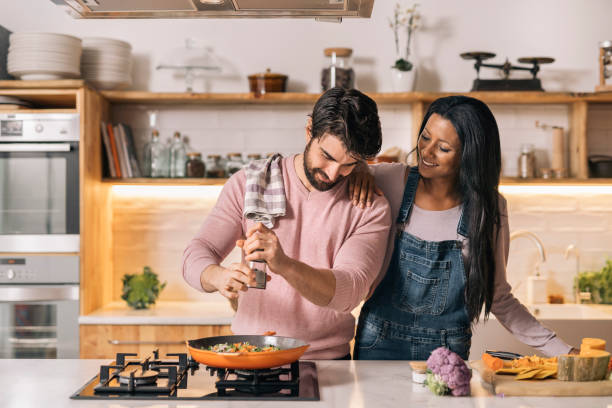 istock Happy Couple Cooking at Home 1407957369