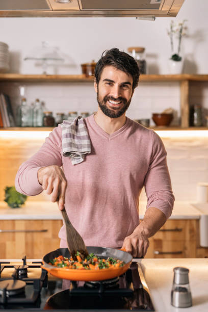 Handsome Man Cooking at Home