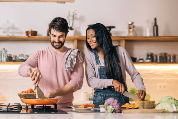istock Happy Couple Cooking at Home 1407957373