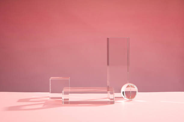 istock Front view of transparent podium decorated with pink background 1407958662