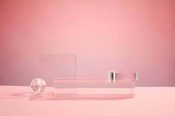 istock Front view of transparent podium decorated with pink background 1407958663