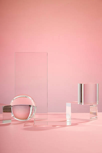 istock Front view of transparent podium decorated with pink background 1407958666