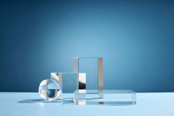 istock Front view of transparent podium glassware decorated in blue background with blank space 1407958742