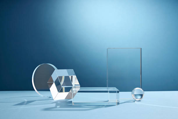 istock Front view of transparent podium glassware decorated in blue background with blank space 1407958745