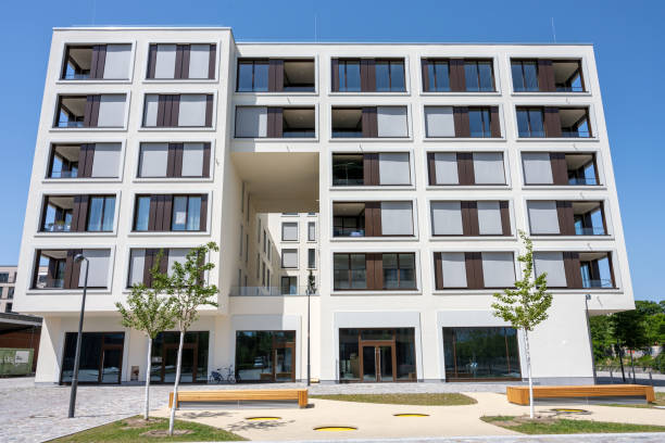 istock Modern apartment building in a housing development area 1407959751