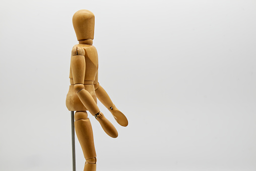 Wooden figure isolated on white background. Wood Figure Mannequin. Space for text.