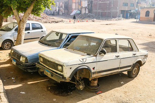 Giza, Egypt - January 26, 2021: Disassembled car Nasr Fiat 128 in the city street.