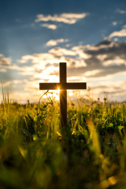 istock Wooden cross at sunset 1407966522