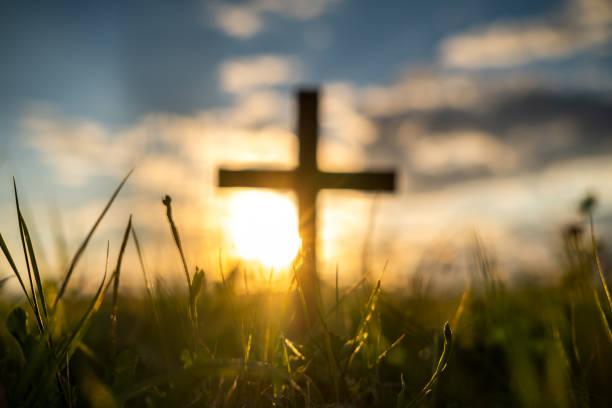 Defocused ooden cross at sunset