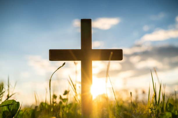 istock Wooden cross at sunset 1407966595