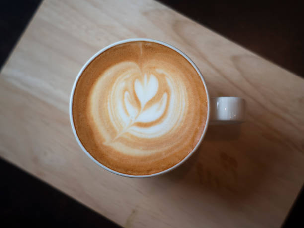 istock latte coffee cup  on wood tray 1407966679