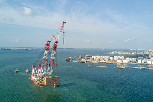 Giant Floating Crane ferrying prefabricated structure in the sea