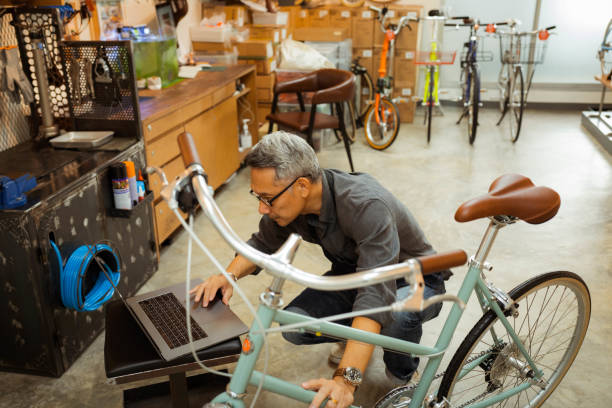 istock Owner of bicycle in his shop. 1407968071
