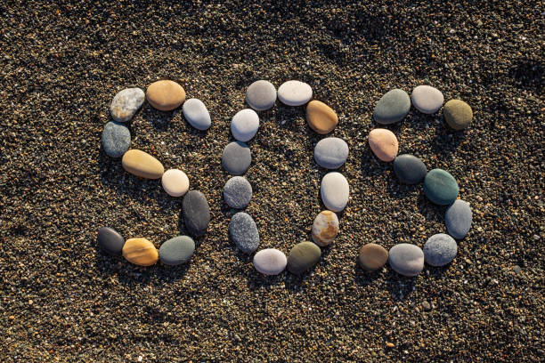 istock SOS message made with stones on the beach 1407968976