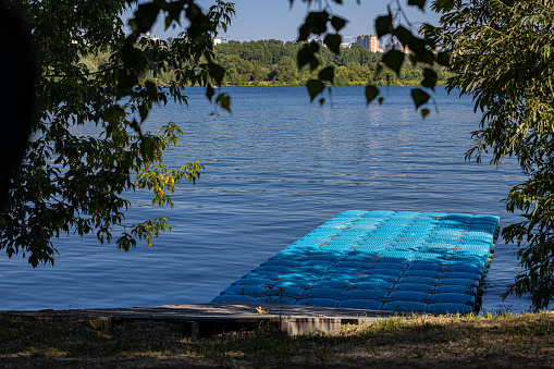 inflatable rubber panton on the shore of the reservoir. High quality photo