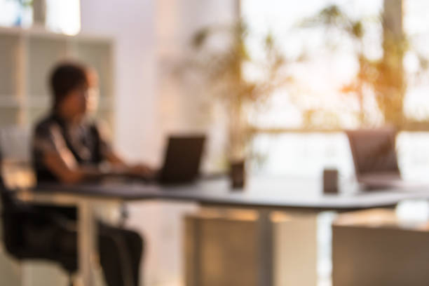 istock Blurred background effect of businesswoman working in office 1407974871