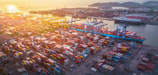 istock The International cargo container depot at sunset , multiple supply chain truck train and cargo ship working service shipping and transportation concept logistic and transport. 1407975961