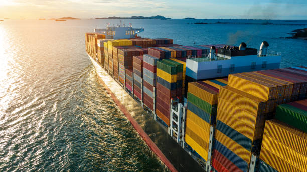 istock Aerial side view of cargo ship carrying container and running for export  goods  from  cargo yard port to custom ocean concept technology transportation , customs clearance. 1407976114