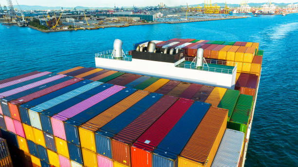 istock Stern of large cargo ship import export container box on the ocean sea on blue sky back ground concept transportation logistic and service to customer and supply change 1407976128