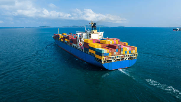 istock Stern of large cargo ship import export container box on the ocean sea on blue sky back ground concept transportation logistic and service to customer and supply change 1407976159