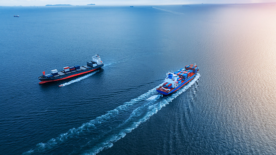 Two cargo large ship running opposite direction concept import export cargo container service and transportation in the ocean logistics and transport trade to custom