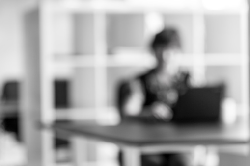 Asian business woman busy at work, defocused blur image effect