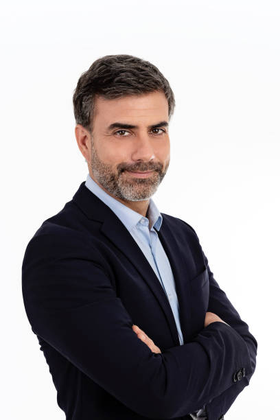 istock Businessman smiling with arms crossed on white background 1407981592