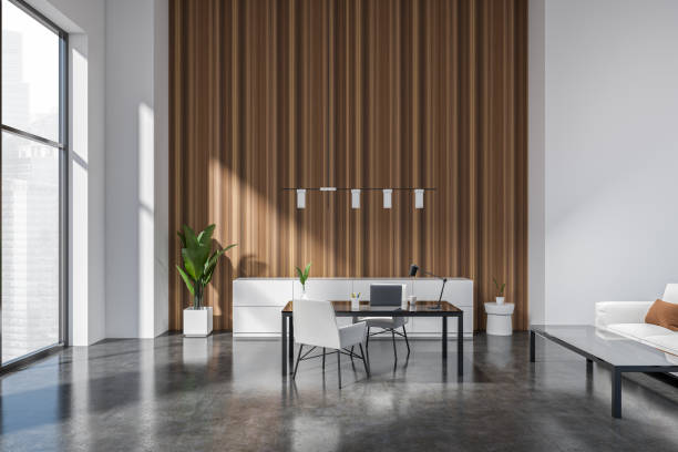 istock Modern office interior with seats and work desk, couch and panoramic window 1407982350