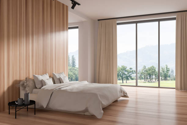 istock Light bedroom interior with bed and nightstand, panoramic window 1407982393