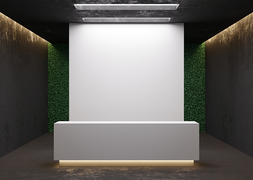 White reception counter in modern room with dark walls. Blank registration desk in hotel, spa or office. Reception mock up with copy space for branding, logo. Contemporary style. 3D rendering