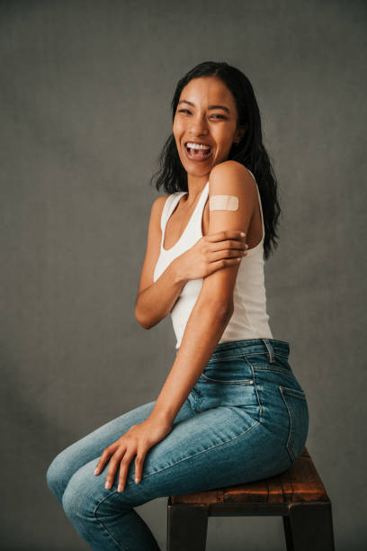 istock Laughing African American female touching her arm 1407984346