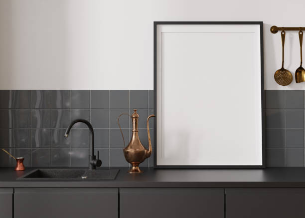 istock Empty vertical picture frame standing in modern kitchen. Mock up interior in minimalist, contemporary style. Free, copy space for your picture, poster. Close up view. 3D rendering. 1407984348