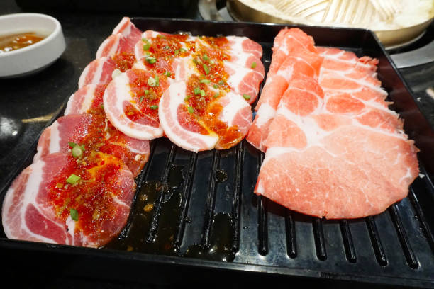 istock Raw food fresh meat on black tray 1407985293
