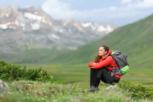 istock Hiker sitting contemplating views in the mountain 1407985922