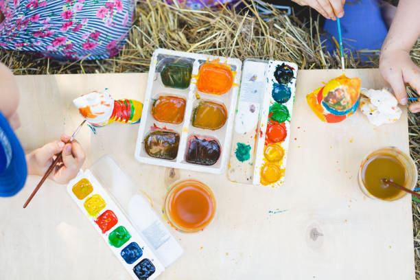 istock Children paint figurines with gypsum paints. 1407990798
