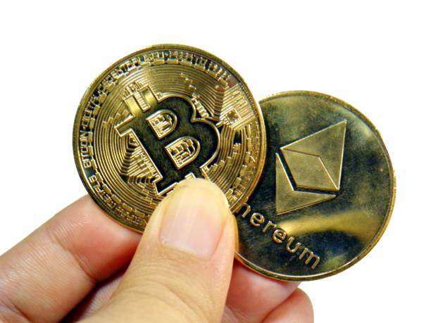 Kaohsiung, Taiwan, July 11, 2022.Hand holding bitcoin and Ethereum on white background,open source code, and blockchain as the underlying technology. symbol of cryptocurrency Bitcoin and Ethereum are cryptocurrencies based on decentralization, adopting peer-to-peer network and consensus initiative, open source code, and blockchain as the underlying technology. symbol of cryptocurrency ethereum stock pictures, royalty-free photos & images