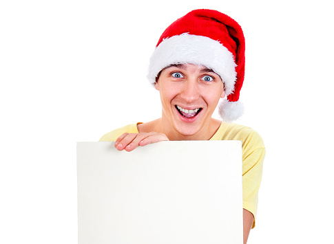 Happy Young Man in Santa Hat with Blank Board