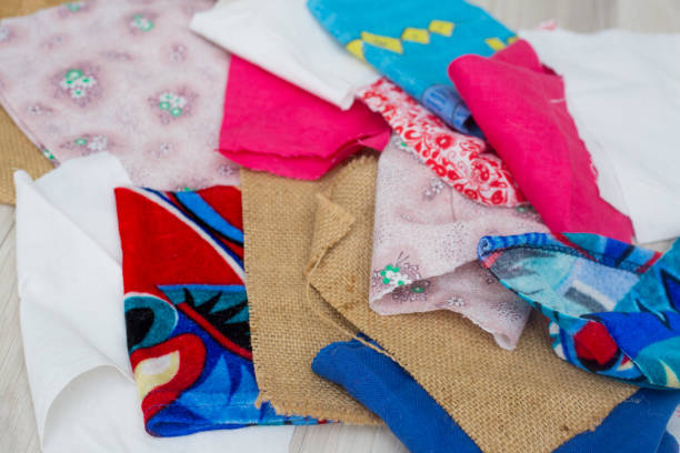 istock Making things with your own hands. Tailoring. Reworking worn out clothes into new models. Sewing kit: scissors, thread, fabric, needles. 1407996480