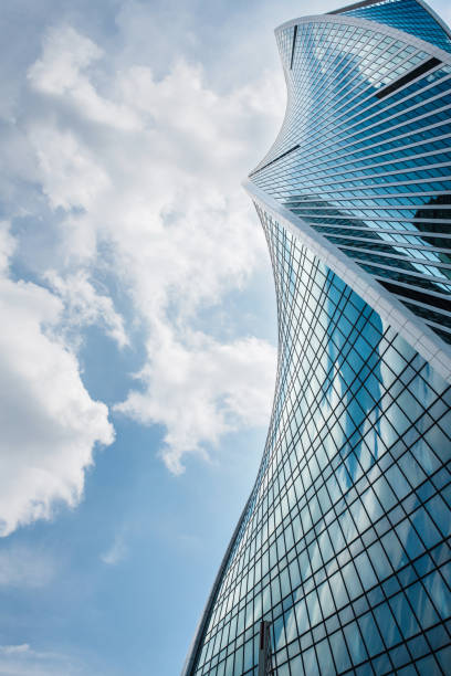 istock Modern twisted office building at sunny day 1407998789