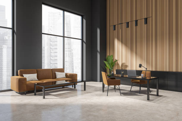 istock Grey office interior with seats and desk, couch and panoramic window 1408000102
