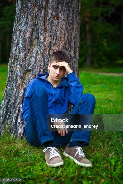 Sad Young Man Stock Photo - Download Image Now - Men, Tree, Below