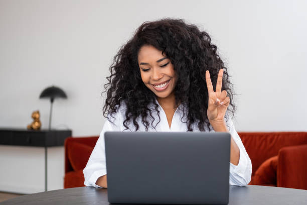 istock African businesswoman smiling, working in home office with computer 1408000565