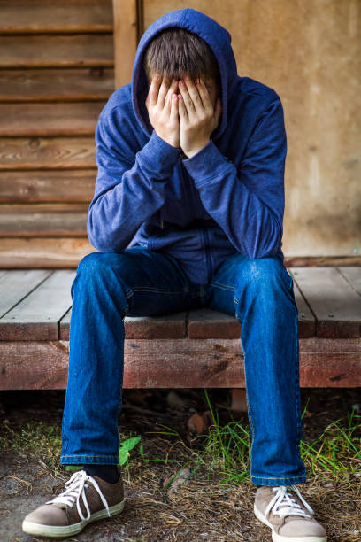 istock Sad Young Man outdoor 1408000674